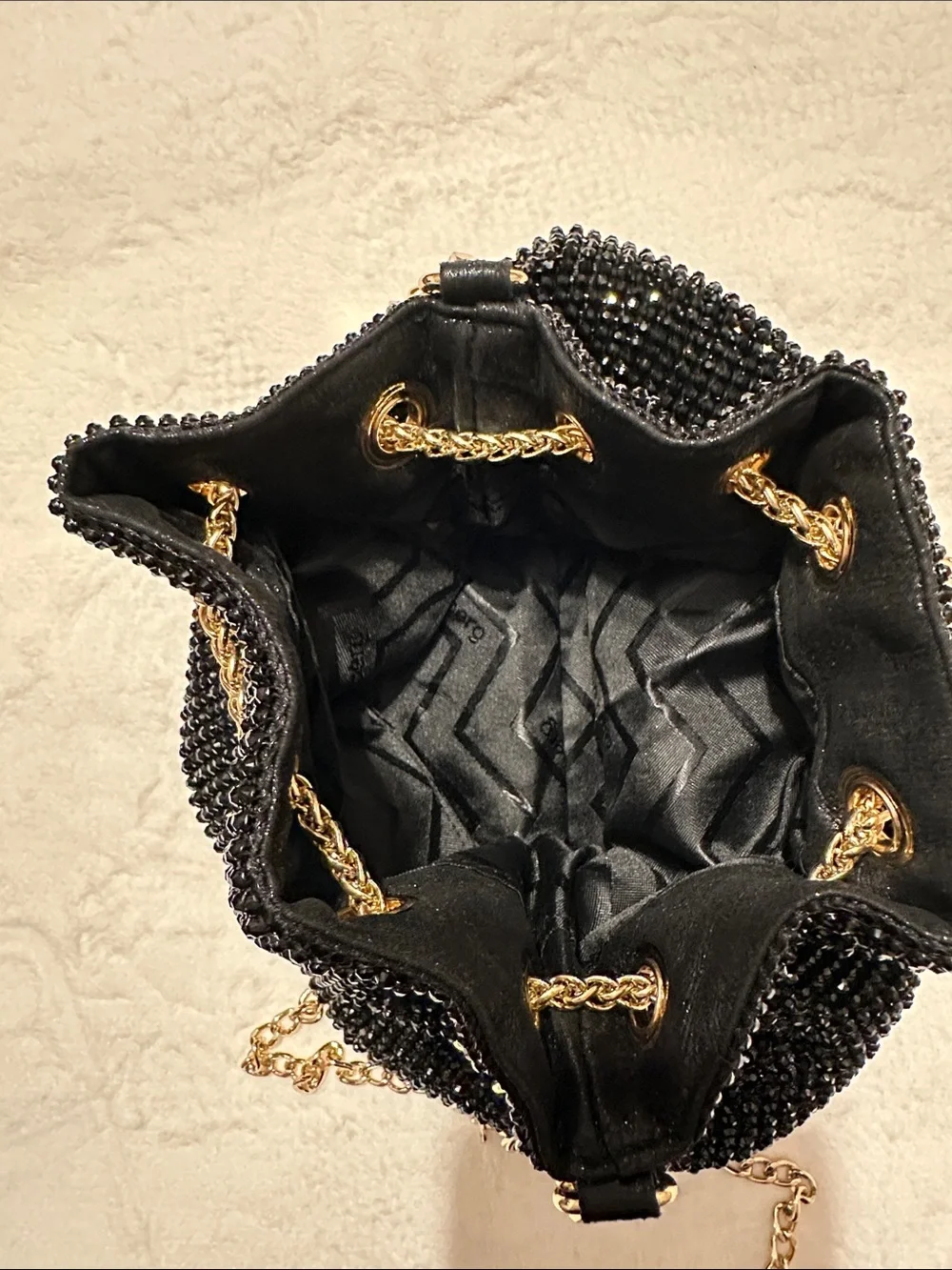 Olga Berg Black Beaded Crossbody Bucket Bag with Gold Chain & Tassels